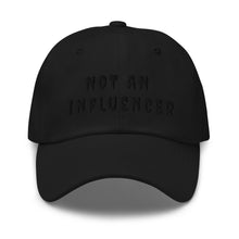 Load image into Gallery viewer, black ball cap with black lettering that says not an influencer for a monochrome look black on black

