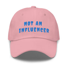 Load image into Gallery viewer, pink ball cap with blue lettering that reads not an influencer
